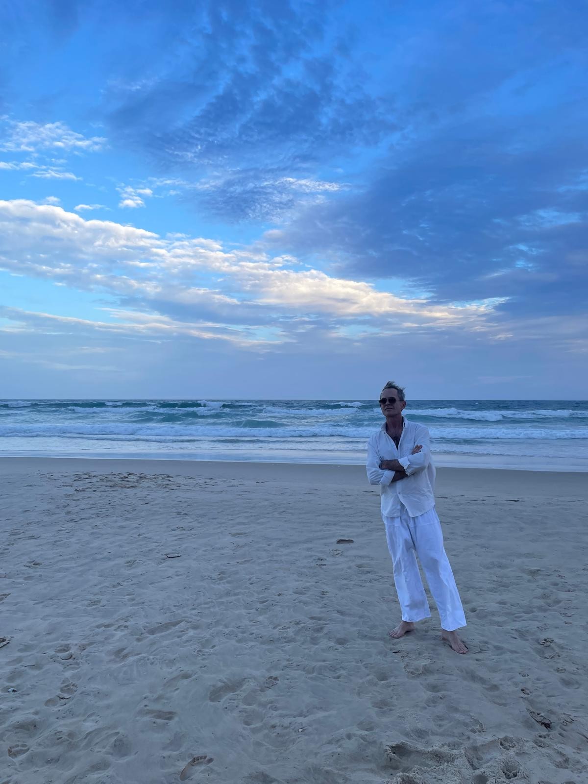 Jeremy A. Lauer on a beach at dusk